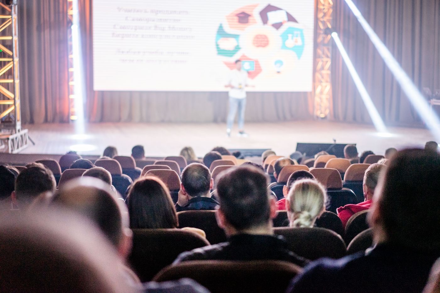 Audience watching a presentation at a conference
