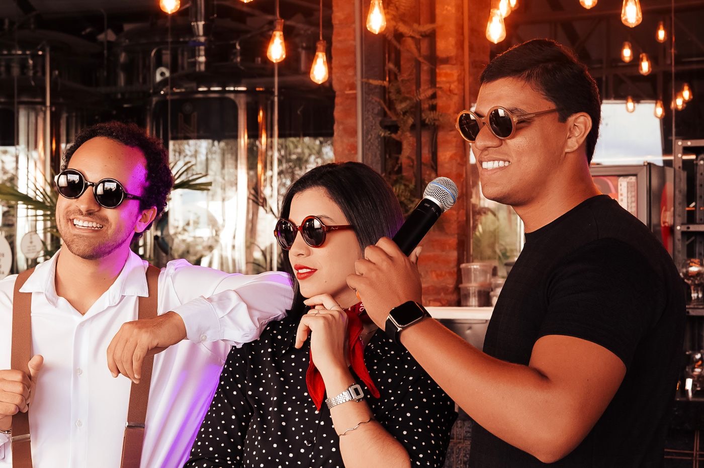 Friends singing together in a karaoke lounge